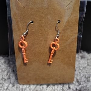 Orange skeleton key earrings